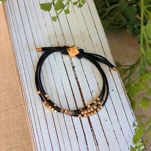 NWOT Black and Gold Adjustable Slide Bracelet